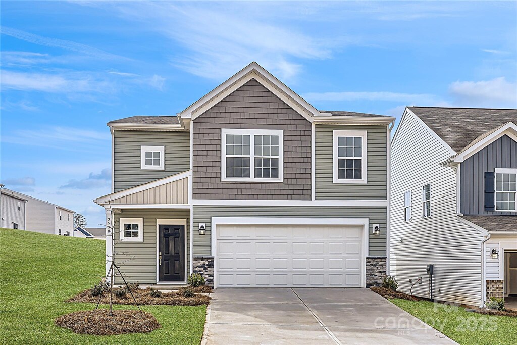 view of front facade with a garage, stone siding, concrete driveway, and a front lawn
