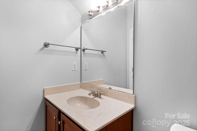 half bath featuring vanity