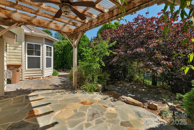 view of patio / terrace with a pergola, a ceiling fan, and fence