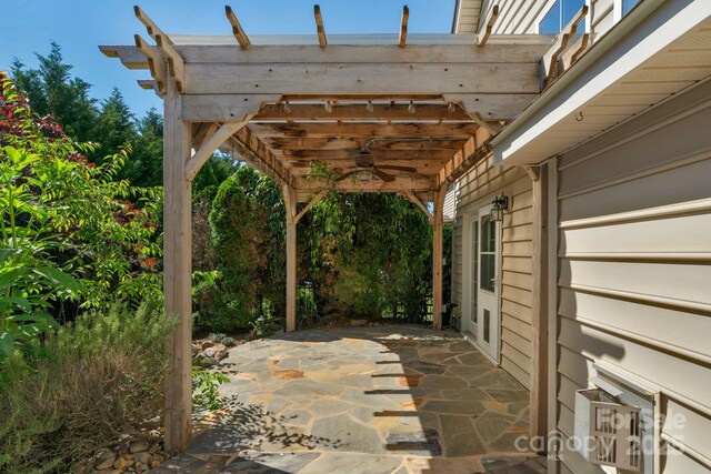 view of patio with a ceiling fan and a pergola