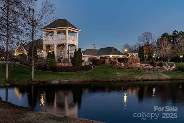 3009 Scottcrest Way, Waxhaw, NC 28173 - back of house featuring a balcony, a lawn, and a water view