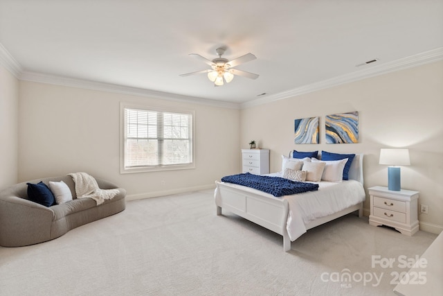 bedroom with crown molding, baseboards, and light colored carpet