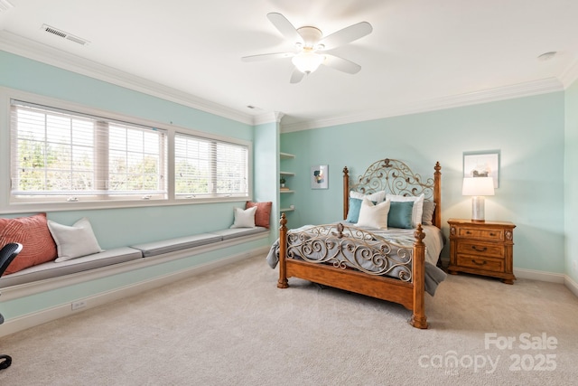 carpeted bedroom with baseboards, visible vents, ceiling fan, and ornamental molding