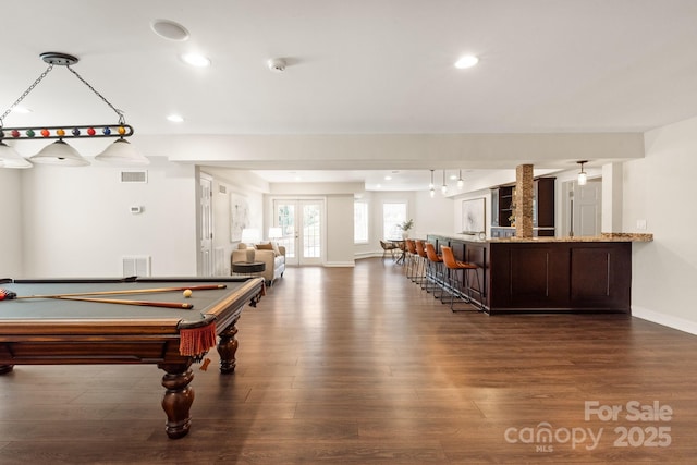 game room featuring recessed lighting, visible vents, dark wood-style flooring, and french doors