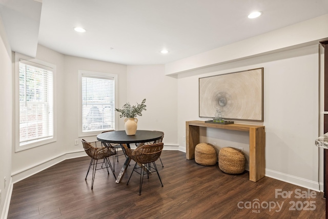 dining space with dark wood-style floors and recessed lighting