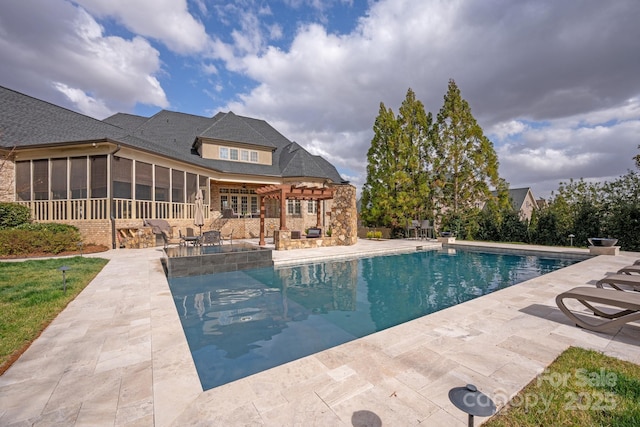 outdoor pool featuring a sunroom, a patio area, and a pergola