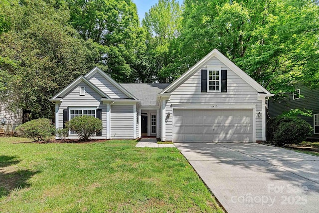 front facade featuring a garage and a front lawn