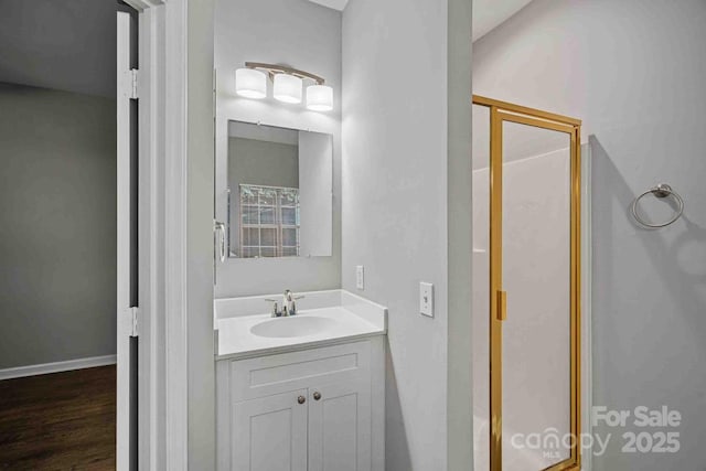 bathroom with vanity and wood-type flooring