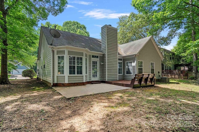 back of house with a patio area