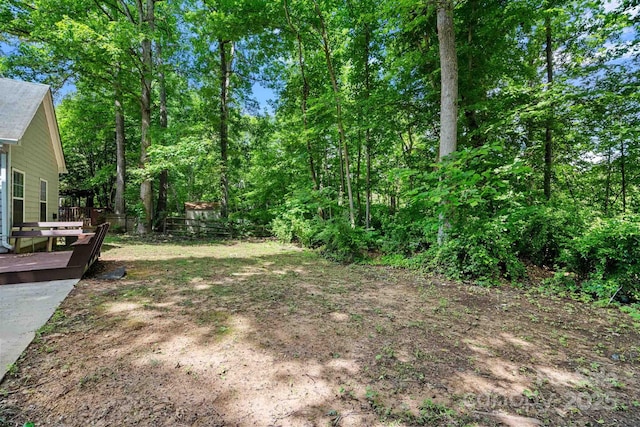 view of yard with a wooden deck