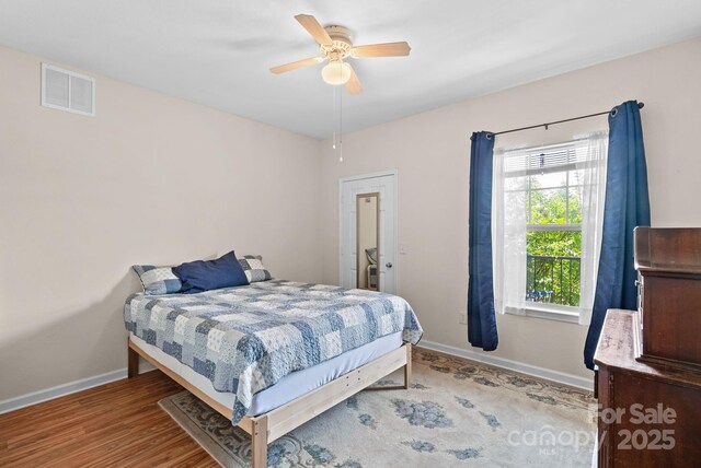 bedroom with ceiling fan and light hardwood / wood-style flooring