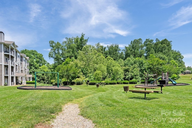 view of property's community featuring a playground and a yard