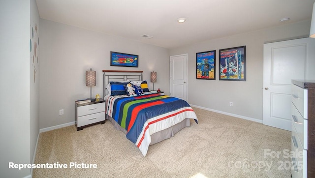 bedroom featuring light colored carpet