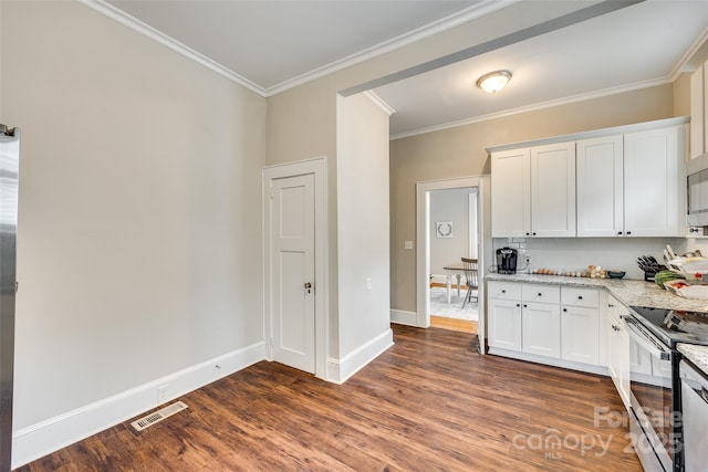 kitchen with white cabinetry, light stone countertops, dark hardwood / wood-style floors, and stainless steel appliances