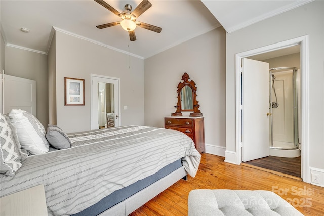 bedroom with hardwood / wood-style flooring, ceiling fan, and crown molding
