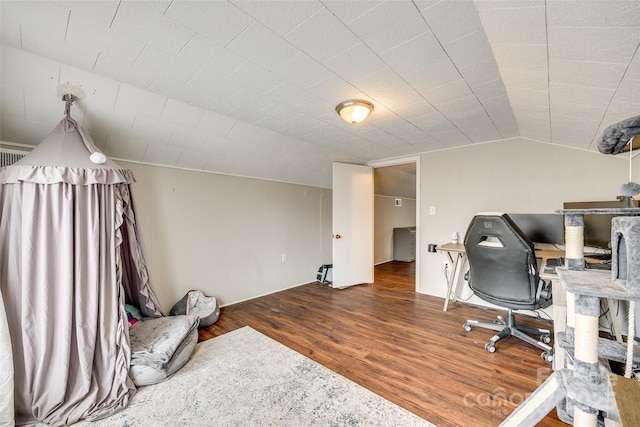 office space with wood-type flooring and vaulted ceiling