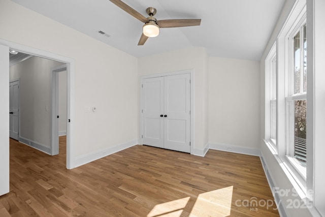 interior space with visible vents, baseboards, and light wood-style floors