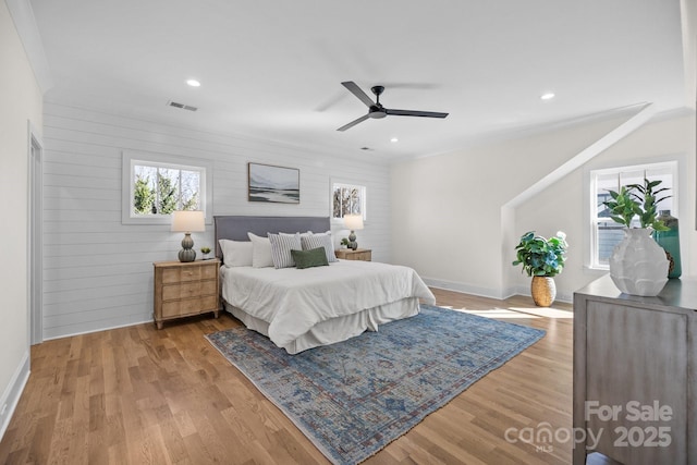 bedroom featuring recessed lighting, visible vents, baseboards, and wood finished floors