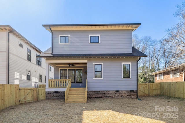 rear view of house with a gate, a ceiling fan, roof with shingles, a fenced backyard, and crawl space