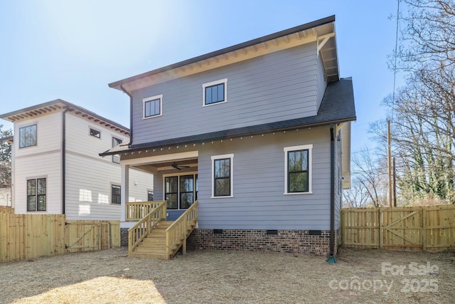 back of house featuring a gate, fence, ceiling fan, a shingled roof, and crawl space