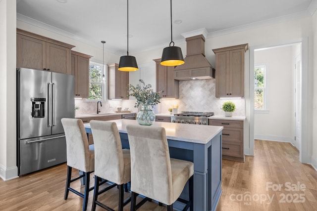 1824 Haines St, Charlotte, NC 28216 - kitchen featuring a sink, a center island, high quality fridge, stove, and custom exhaust hood
