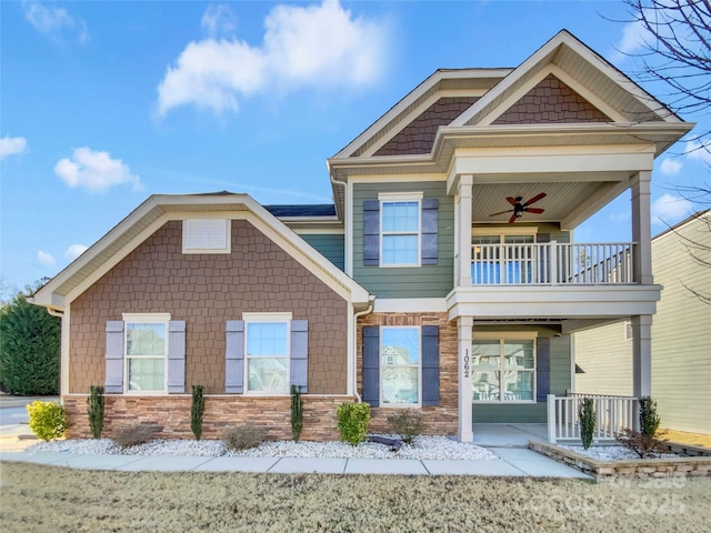 craftsman-style house with ceiling fan, a balcony, and a porch