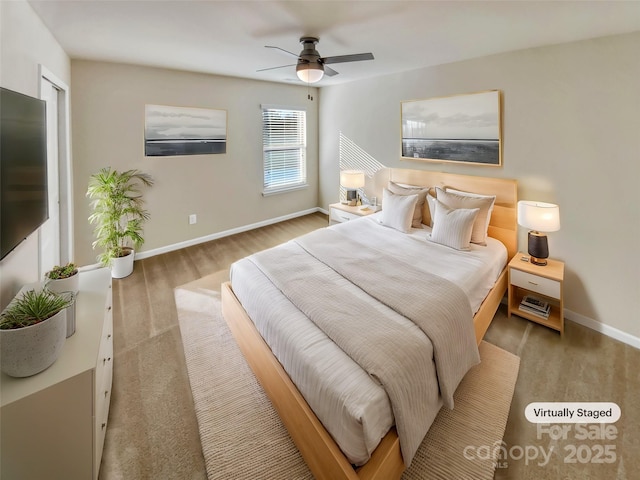 bedroom with hardwood / wood-style flooring and ceiling fan