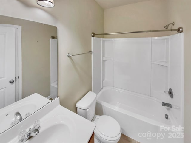 full bathroom with vanity, toilet, and washtub / shower combination