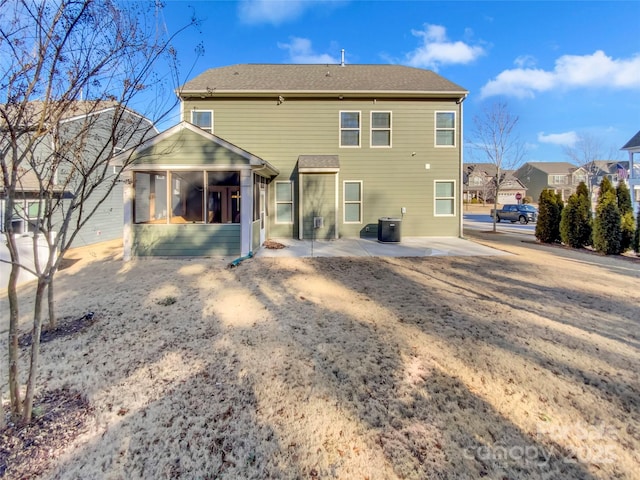 back of house with a patio area and a sunroom