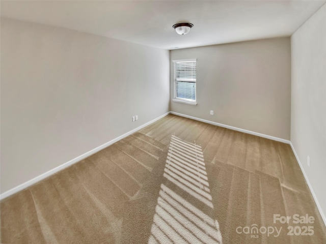 spare room featuring carpet flooring