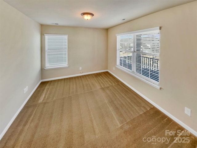 unfurnished room with carpet flooring