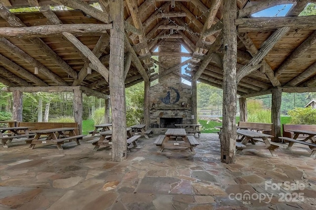 view of patio / terrace with an outdoor stone fireplace