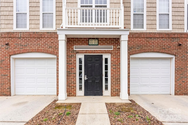 doorway to property featuring a garage