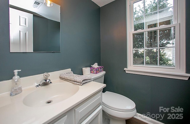 bathroom with vanity and toilet