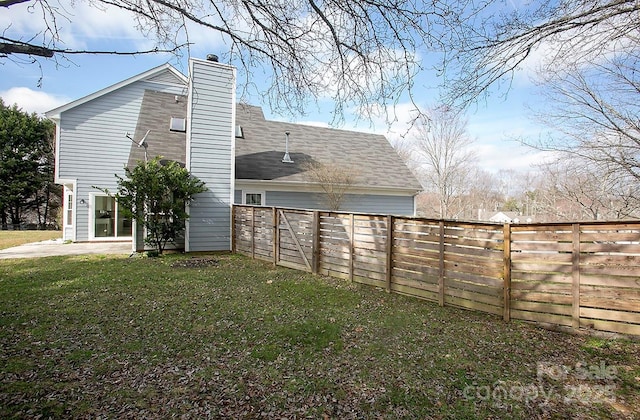 view of home's exterior with a lawn