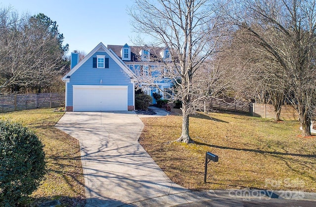 front of property featuring a garage and a front yard