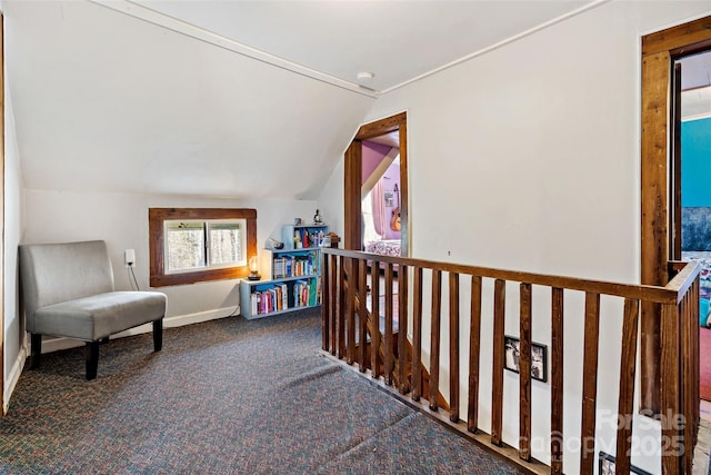 living area featuring vaulted ceiling and carpet flooring