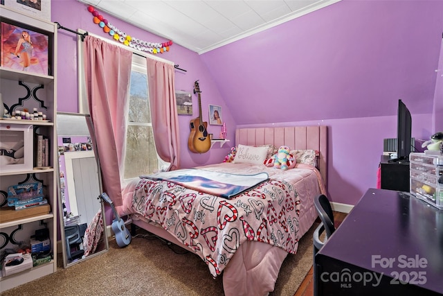 bedroom with carpet floors and vaulted ceiling