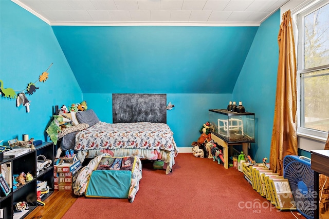 carpeted bedroom with lofted ceiling