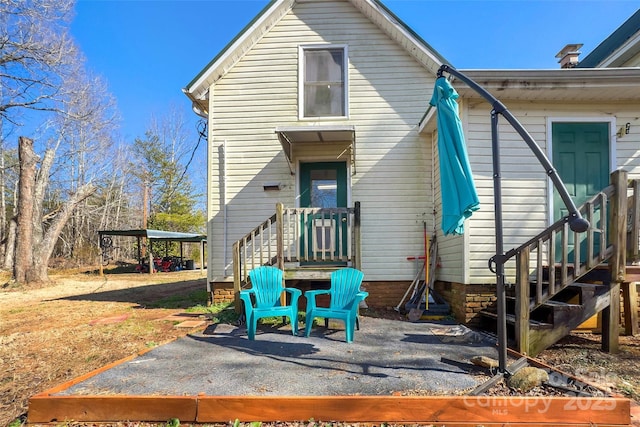 back of property featuring a patio