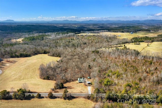 birds eye view of property featuring a mountain view and a rural view