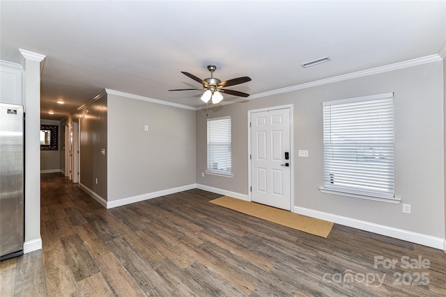 foyer featuring visible vents, baseboards, ceiling fan, dark wood-type flooring, and crown molding