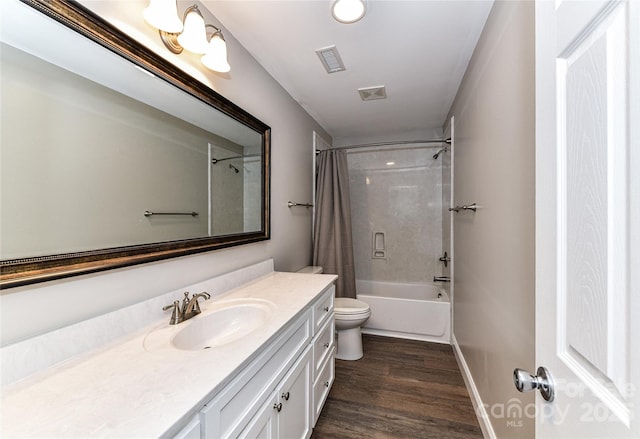 bathroom with toilet, shower / tub combo, wood finished floors, vanity, and visible vents