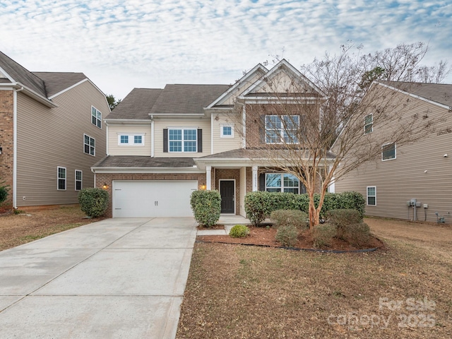 craftsman-style house featuring a garage and a front yard