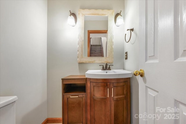 bathroom with vanity and toilet