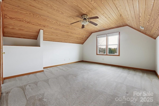 bonus room featuring ceiling fan, vaulted ceiling, light carpet, and wooden ceiling