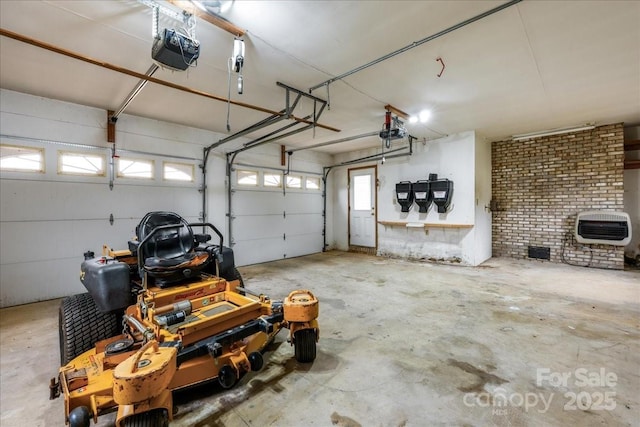 garage with a garage door opener and heating unit