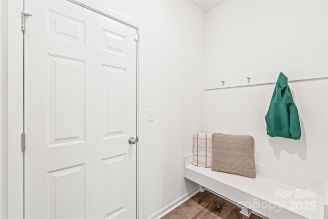 mudroom with baseboards and wood finished floors