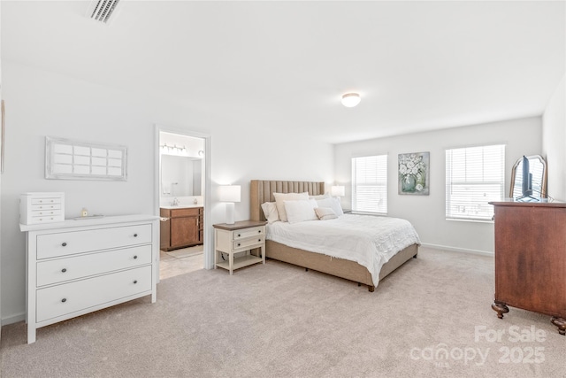 bedroom featuring light colored carpet, connected bathroom, visible vents, and baseboards