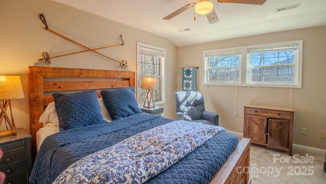 bedroom featuring vaulted ceiling, multiple windows, carpet, and visible vents